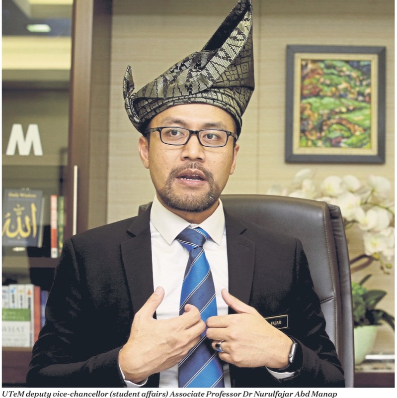 Dr Nurulfajar Abd Manap wearing a traditional tanjak during an interview as UTeM deputy vice-chancellor for student affairs