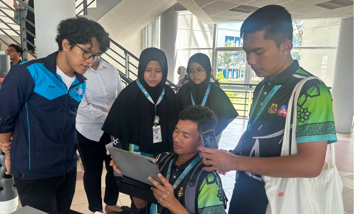 Students demonstrating an Integrated Design Project prototype